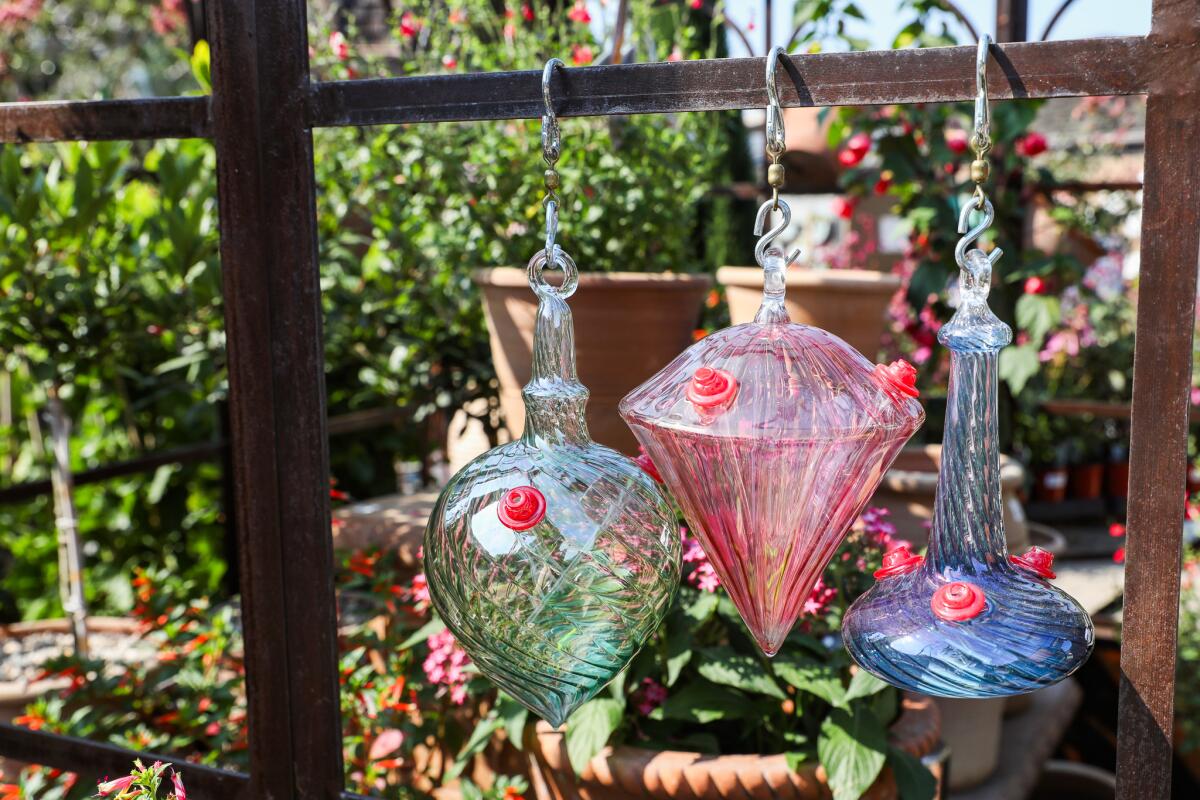 Hummingbird feeders on display at Roger's Gardens in Corona del Mar.