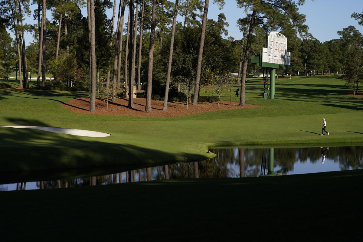 Corey Conners walks down the 16th fairway during the second round of the Masters golf tournament Friday.