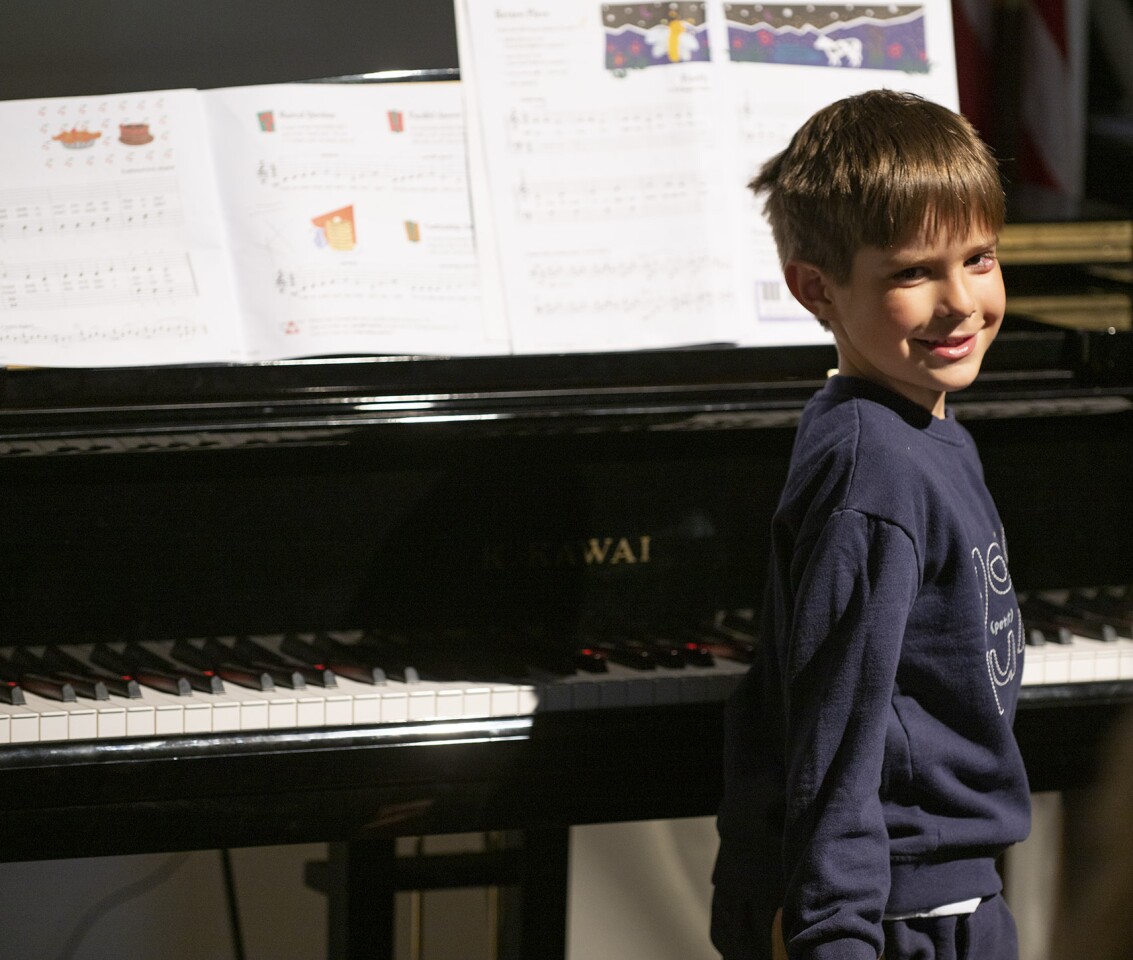 Luke Rhett played "Ode to Joy" and "Grandmother's Tune" on the piano