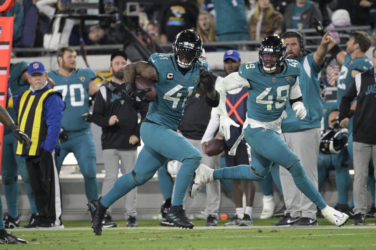 Jaguars linebacker Josh Allen (41) returns a fumble for a touchdown in the fourth quarter Jan. 7, 2023.