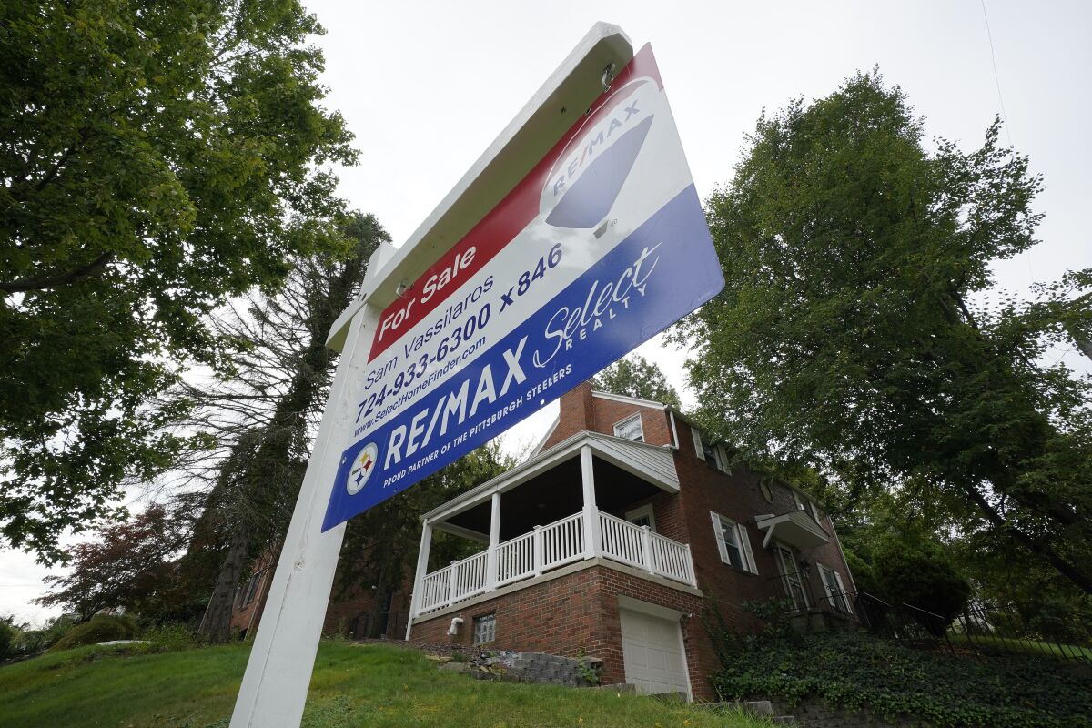 This is a home for sale in Mount Lebanon, Pa., on Tuesday, Sept. 21, 2021. Average long-term U.S. mortgage rates fell slightly this week, after rising to their highest level in three years last week. The average rate on a 30-year loan declined to 3.89% this week from 3.92% the previous week, mortgage buyer Freddie Mac reported Thursday, Feb. 24, 2022. (AP Photo/Gene J. Puskar)