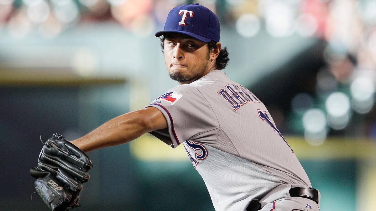 Texas Rangers starter Yu Darvish delivers a pitch against the Houston Astros on Saturday.