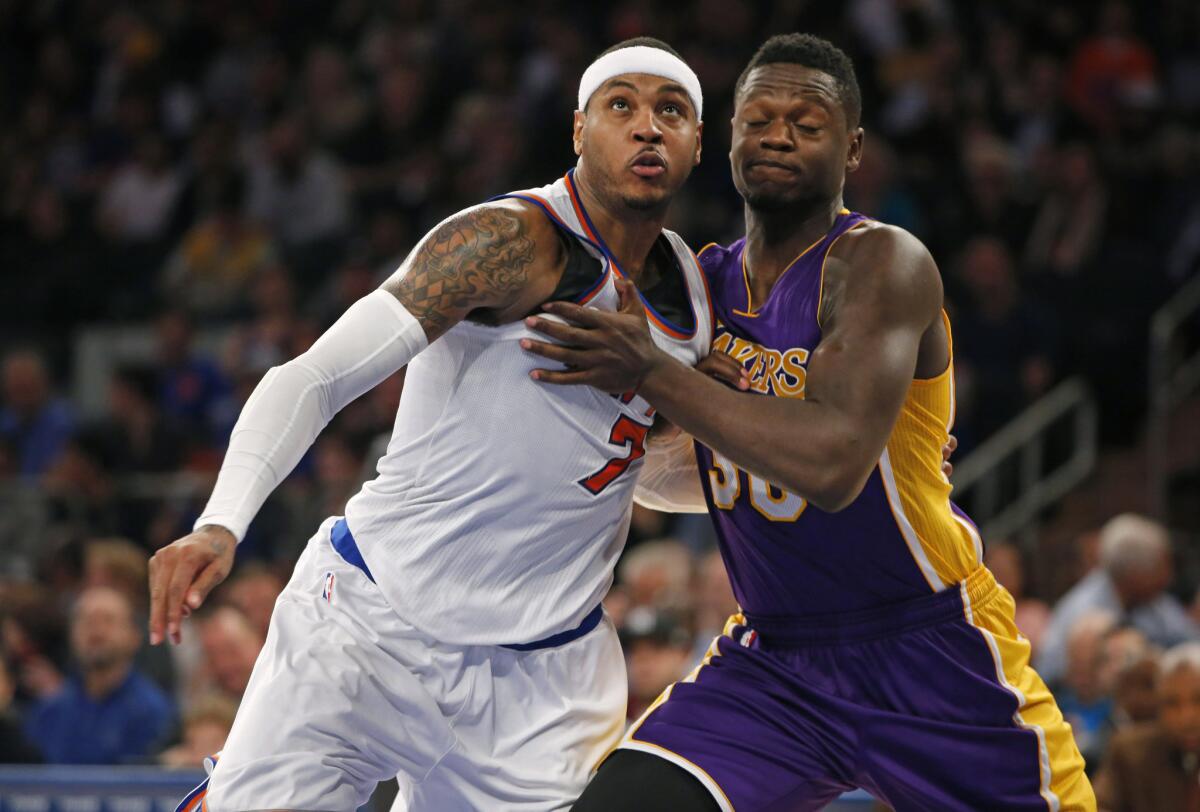 Knicks forward Carmelo Anthony and Lakers forward Julius Randle battle for rebounding position in a Nov. 8 game at New York's Madison Square Garden.