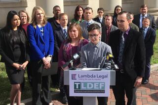 FILE - Connor Thonen-Fleck addresses reporters while his parents stand by his side, March 11, 2019, in Durham, N.C. West Virginia and North Carolina's refusal to cover certain health care for transgender people with government-sponsored insurance is discriminatory, a federal appeals court ruled Monday, April 29, 2024 in a case likely headed to the U.S. Supreme Court. (AP Photo/ Jonathan Drew, FIle)