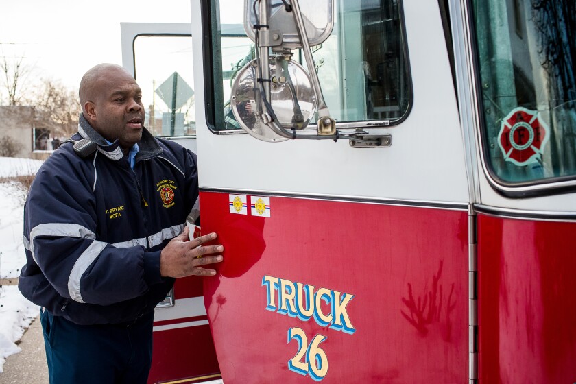 Fireman Avon Bryant is at the truck. (Shawn Hubbard/Ravens)
