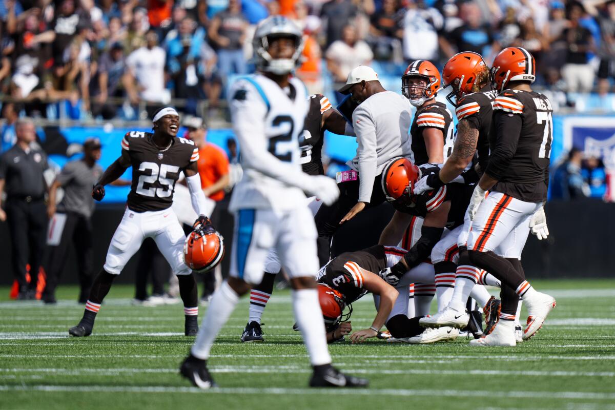 The Cleveland Browns celebrate a game winning kick by place kicker Cade York during the second half of an NFL football game against the Carolina Panthers on Sunday, Sept. 11, 2022, in Charlotte, N.C. (AP Photo/Jacob Kupferman)