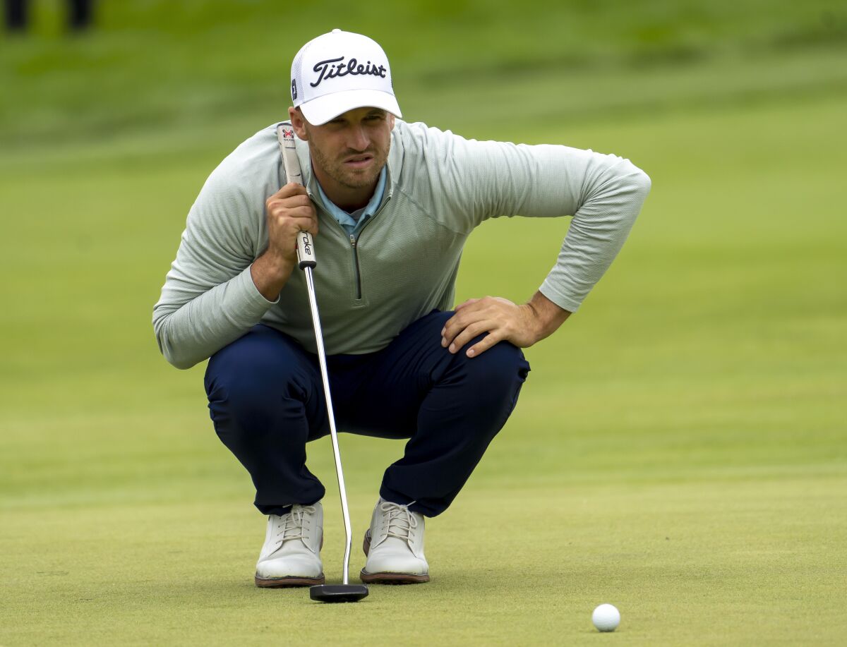Wyndham Clark lines up his putt on the eighth green during the first round of the Canadian Open golf tournament in Toronto on Thursday, June 9, 2022. (Frank Gunn/The Canadian Press via AP)