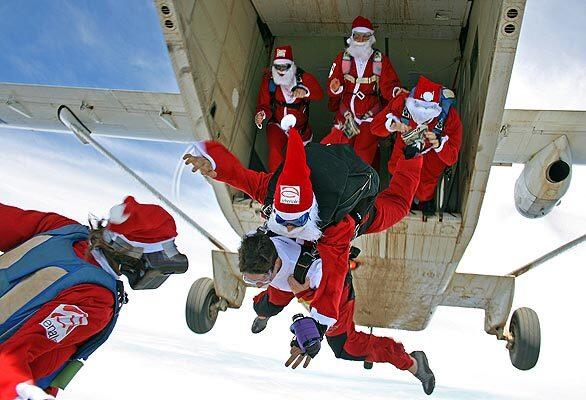 Thrill-seeking Santa Clauses take the plunge over Picton in Australia's Southern Highlands.