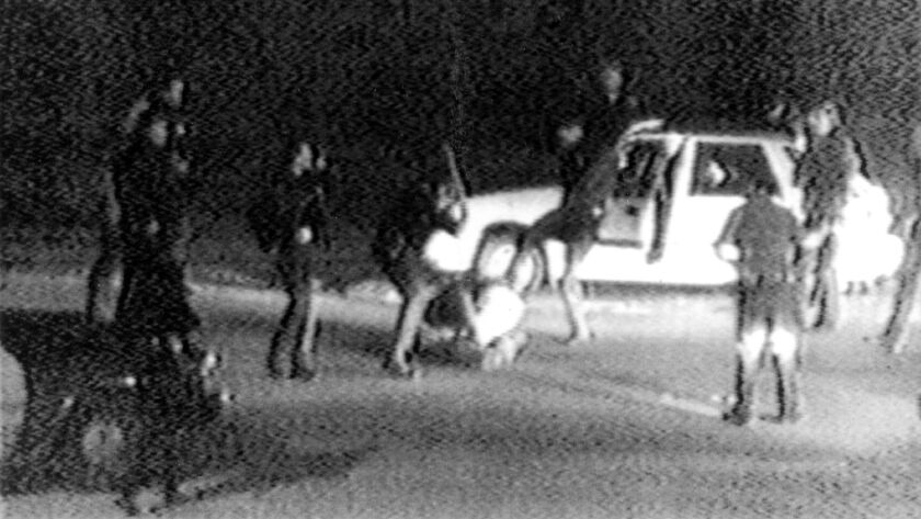 This March 31, 1991 image made from video shot by George Holliday shows LAPD officers beating a man, later identified as Rodney King.