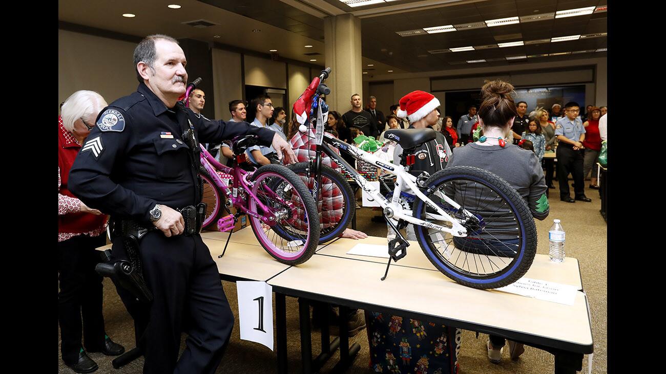 Photo Gallery: Glendale Police Cops for Kids delivers gifts to families in time for Christmas
