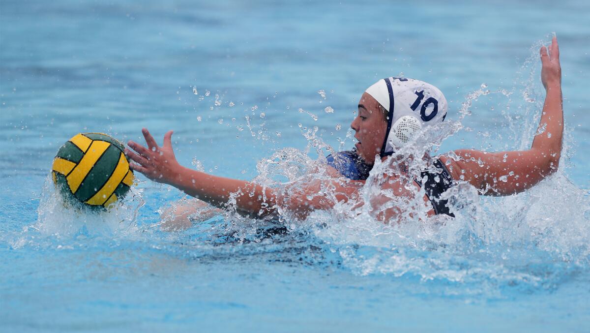 Flintridge Prep's Makena Walklett (10) defends against Marina's Maddison Clobes during the first half in the CIF Southern Section Division VI championship match at Woollett Aquatics Center in Irvine on Saturday.