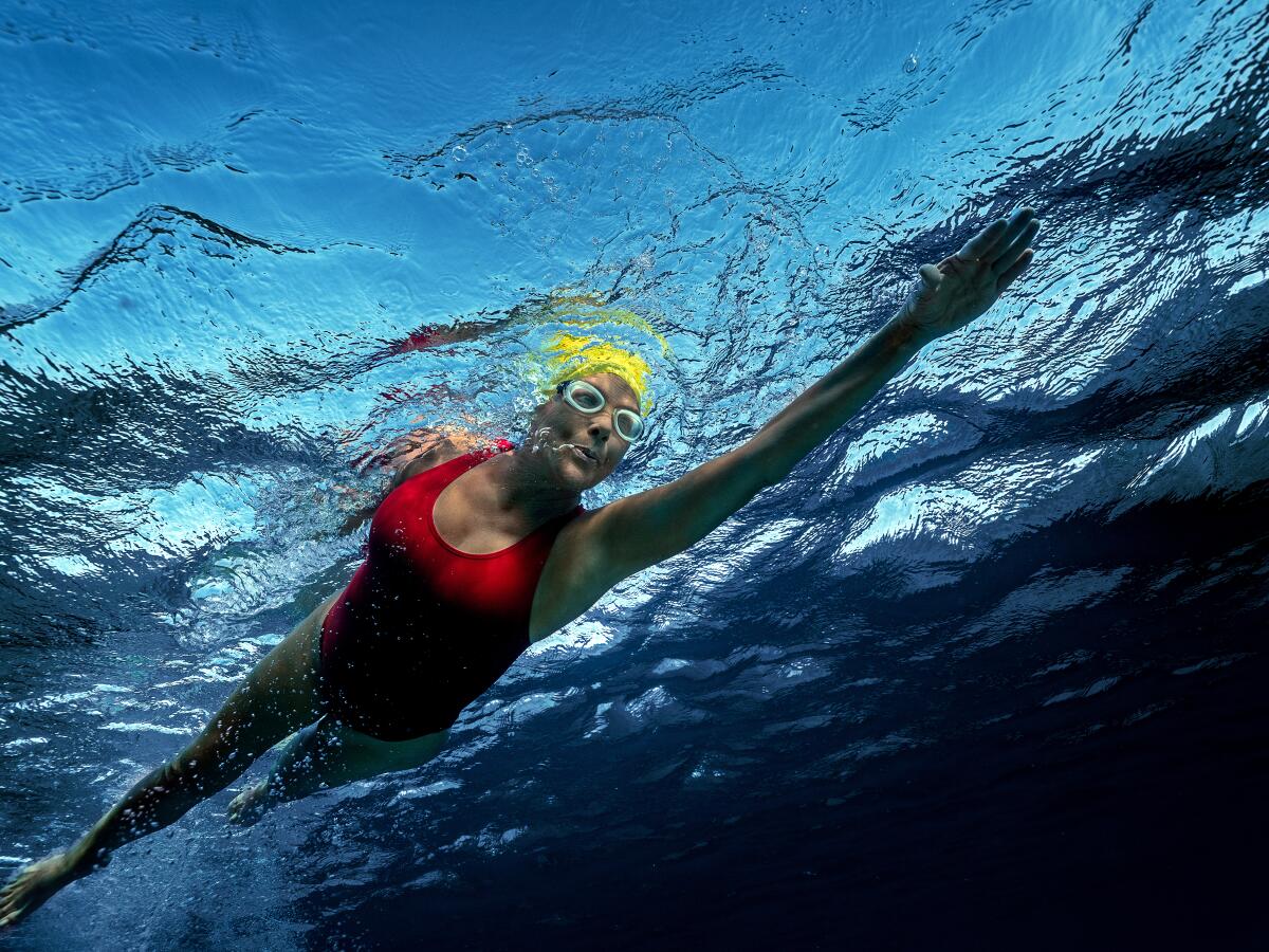 A woman swims in the open ocean.