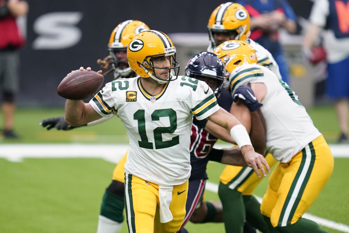 Green Bay Packers quarterback Aaron Rodgers looks to pass against the Houston Texans on Sunday.