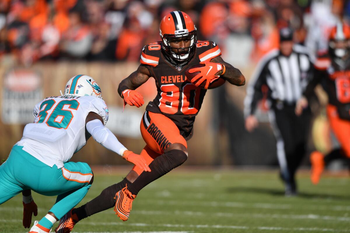 Cleveland Browns wide receiver Jarvis Landry tries to run past Miami Dolphins safety Adrian Colbert.