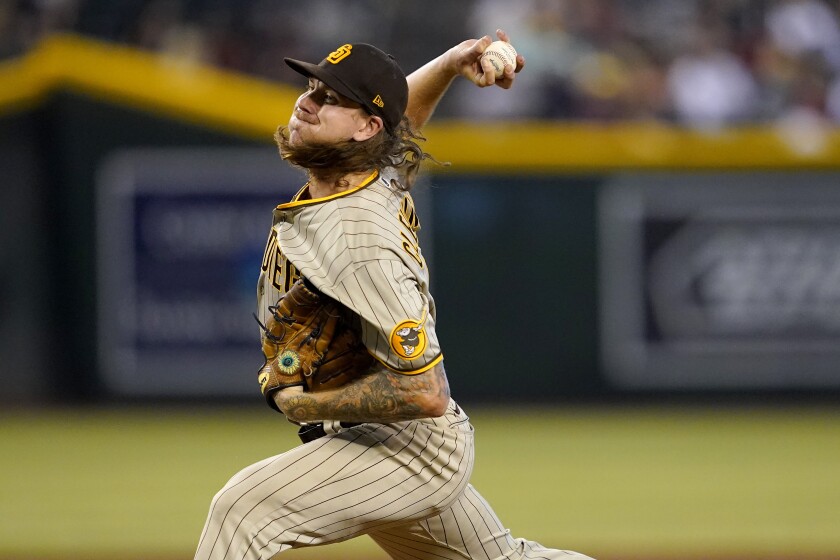 San Diego Padres starting pitcher Mike Clevinger throws against the Arizona Diamondbacks during the seventh inning of a baseball game, Wednesday, June 29, 2022, in Phoenix. (AP Photo/Matt York)