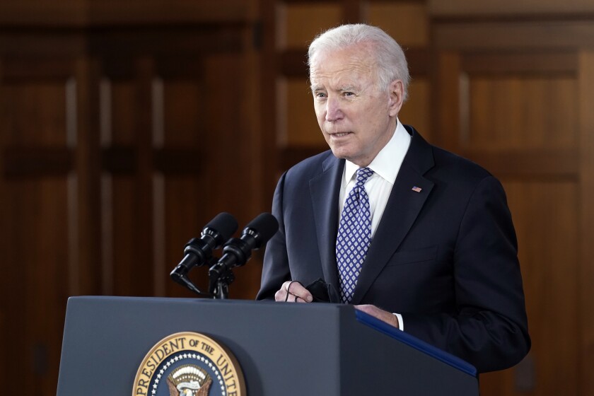 President Biden speaks from a lectern
