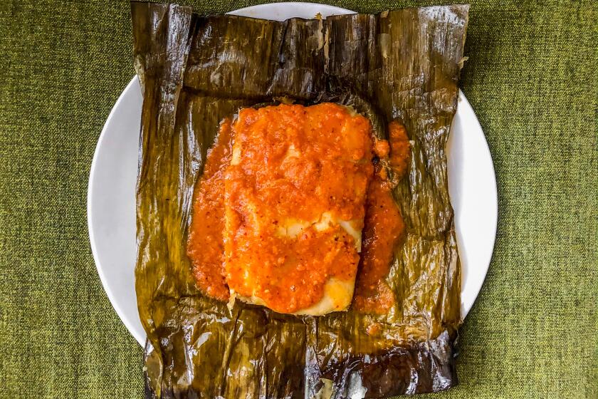 LOS ANGELES, CA.,(April 2, 2020)-Jalapeno and cheese tamal from Mi Ranchito Veracruz, steamed in banana leaf. (Bill Addison/Los Angeles Times)
