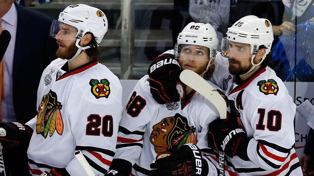 Patrick Kane of the Chicago Blackhawks walks out with teammates