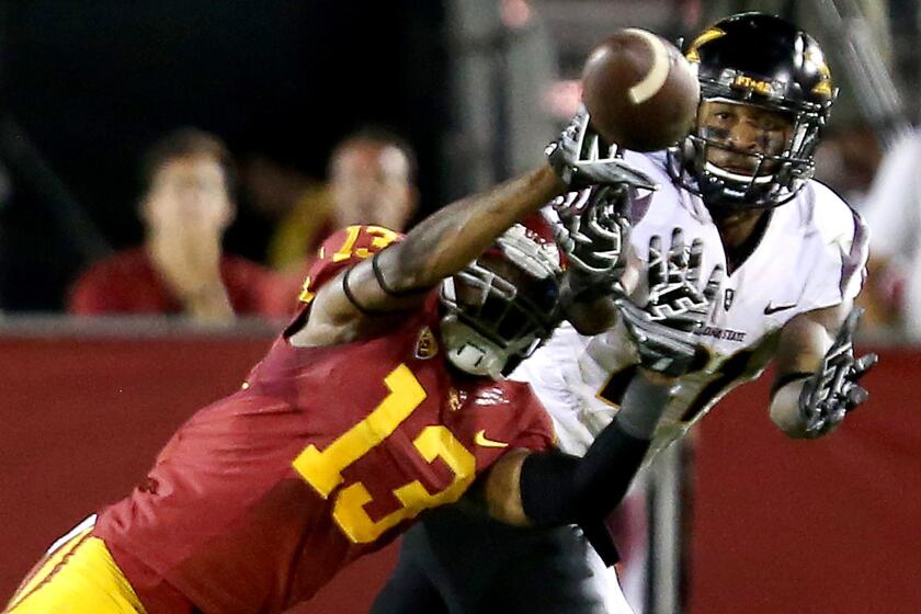 USC defensive back Kevon Seymour breaks up a pass intended for Arizona State wide receiver Gary Chambers.