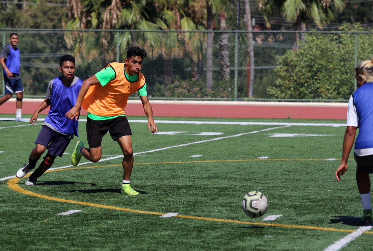 Glendale Community College men's soccer player Jafet Perez goes for the ball during a team scrimmage at Sartoris Field.