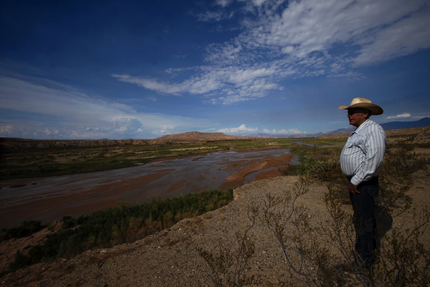 Rancher Cliven Bundy, 67, looks over the Virgin River on some of his 150 square miles of property in Bunkerville, Nevada on August 20, 2013.