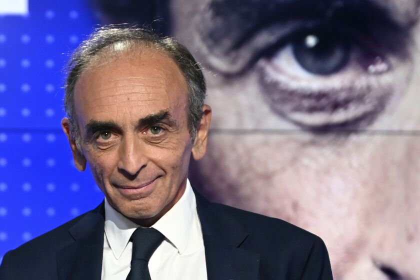 FILE - In this Sept.23, 2021 file photo, French far-right media pundit Eric Zemmour poses prior to a televised debate between French far-left leader, Jean-Luc Melenchon in Paris. Eric Zemmour is a rabble-rousing television pundit and author with repeated convictions for hate speech who is finding large and fervent audiences for his anti-Islam, anti-immigration invective in the early stages of France's presidential race . (Bertrand Guay, Pool Photo via AP, File)