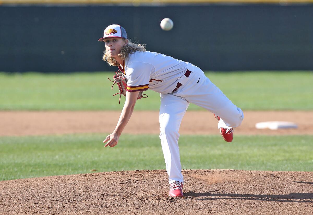 Estancia starter Dillon Manchester throws in the first inning of an Orange Coast League opener against Calvary Chapel on Monday in Costa Mesa.
