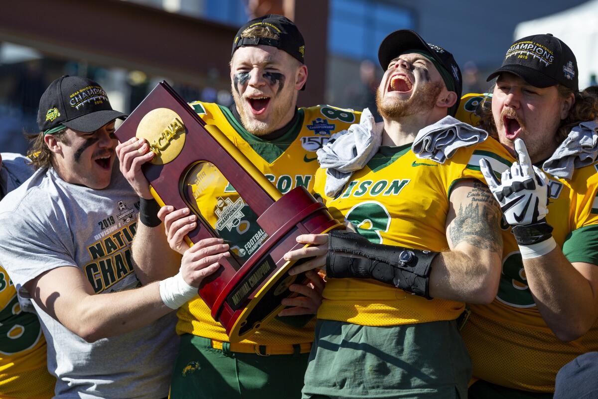 North Dakota State players celebrate after the Bison extended their FCS-record winning streak to 37 in a row.