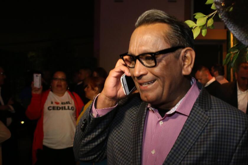 L.A. City Councilman Gil Cedillo takes a congratulations phone call during his election-night party in Los Angeles.
