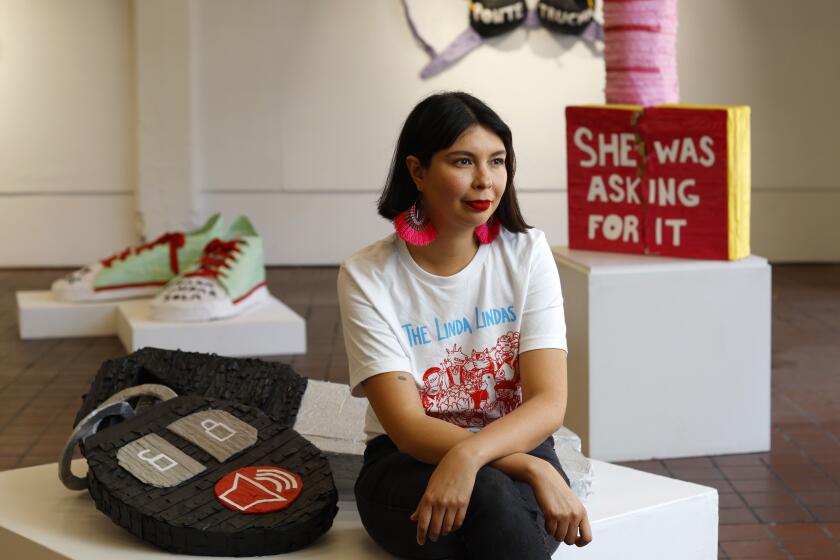 SAN DIEGO, CA - APRIL 5, 2022: Artist Diana Benavidez in her exhibition called Text Me When You Get Home at the Athenaeum Art Center in Logan Heights on Tuesday, April 5, 2022. (K.C. Alfred / The San Diego Union-Tribune)