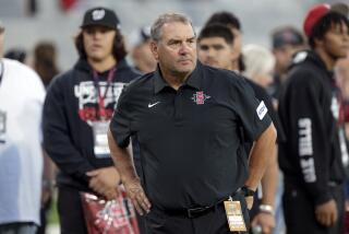 SAN DIEGO, CA - SEPTEMBER 02, 2023: Aztecs head football coach Brady Hoke watches his players warmup before the start of the Aztecs play against Idaho State at Snapdragon Stadium in San Diego on Saturday, September 02, 2023. (Hayne Palmour IV / For The San Diego Union-Tribune)