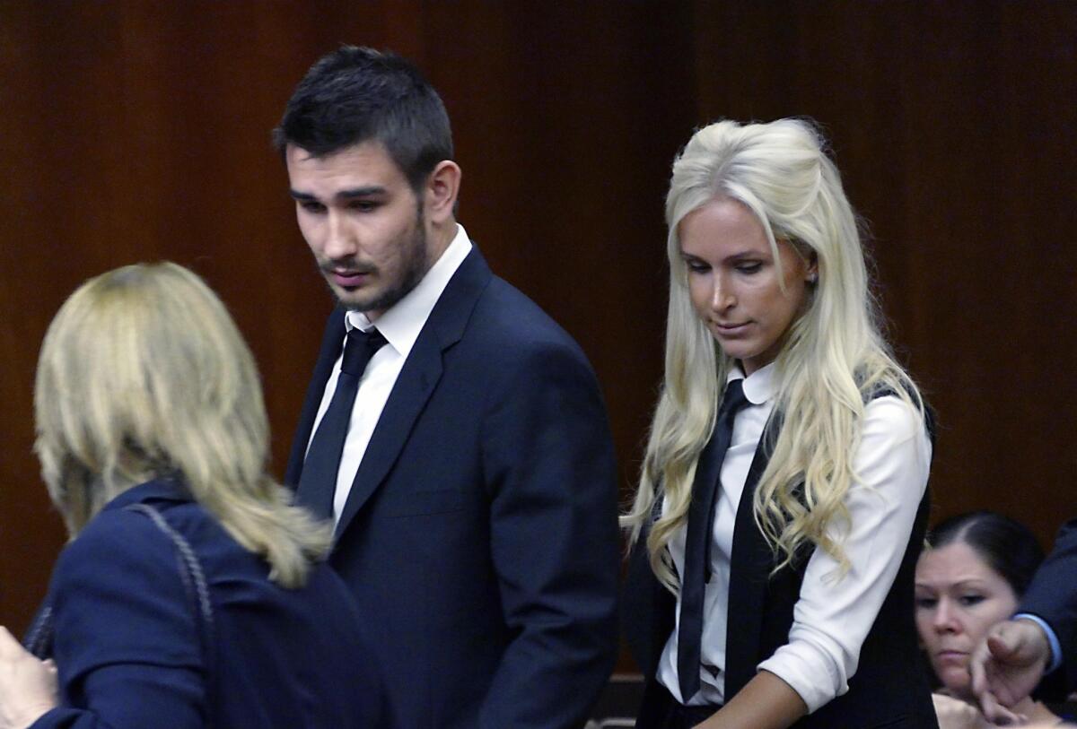 Slava Voynov enters Los Angeles County Superior Court with his wife, Marta Varlamova, on July 2.