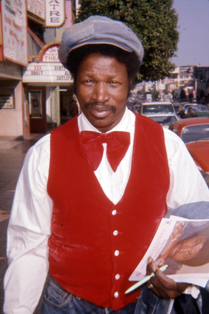 Los Angeles, California-Rudy Ray Moore is photographed in front of an adult movie theater in Hollywood. The handwritten date on the slide is September 28, 1975. (Photograph by Jon Verzi) (ONE TIME USE)