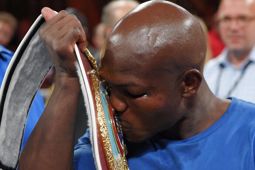 Timothy Bradley kisses the welterweight belt after defeating Jessie Vargas on June 27 in Carson.