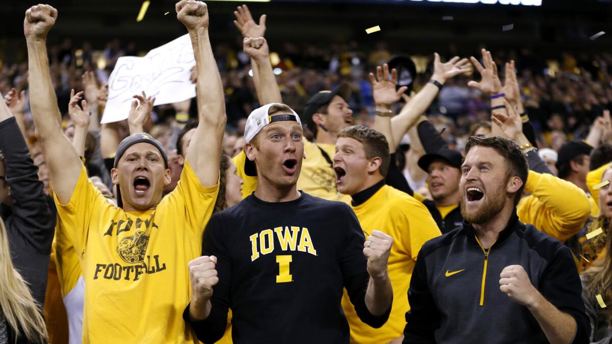 Iowa fans cheer after quarterback C.J. Beathard threw an 85-yard touchdown to Tevaun Smith during the Big Ten Conference championship game on Dec. 5.