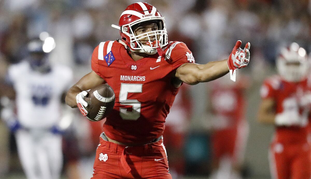 Mater Dei receiver Bru McCoy finished with 77 receptions for 1,428 yards and 18 touchdowns. He also played linebacker and recorded five sacks.