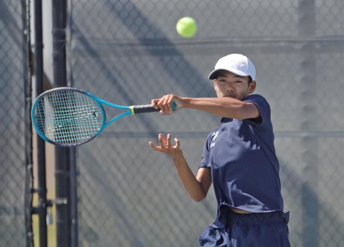 Marina doubles player Trevor Nguyen hits a forehand during Wednesday's match.