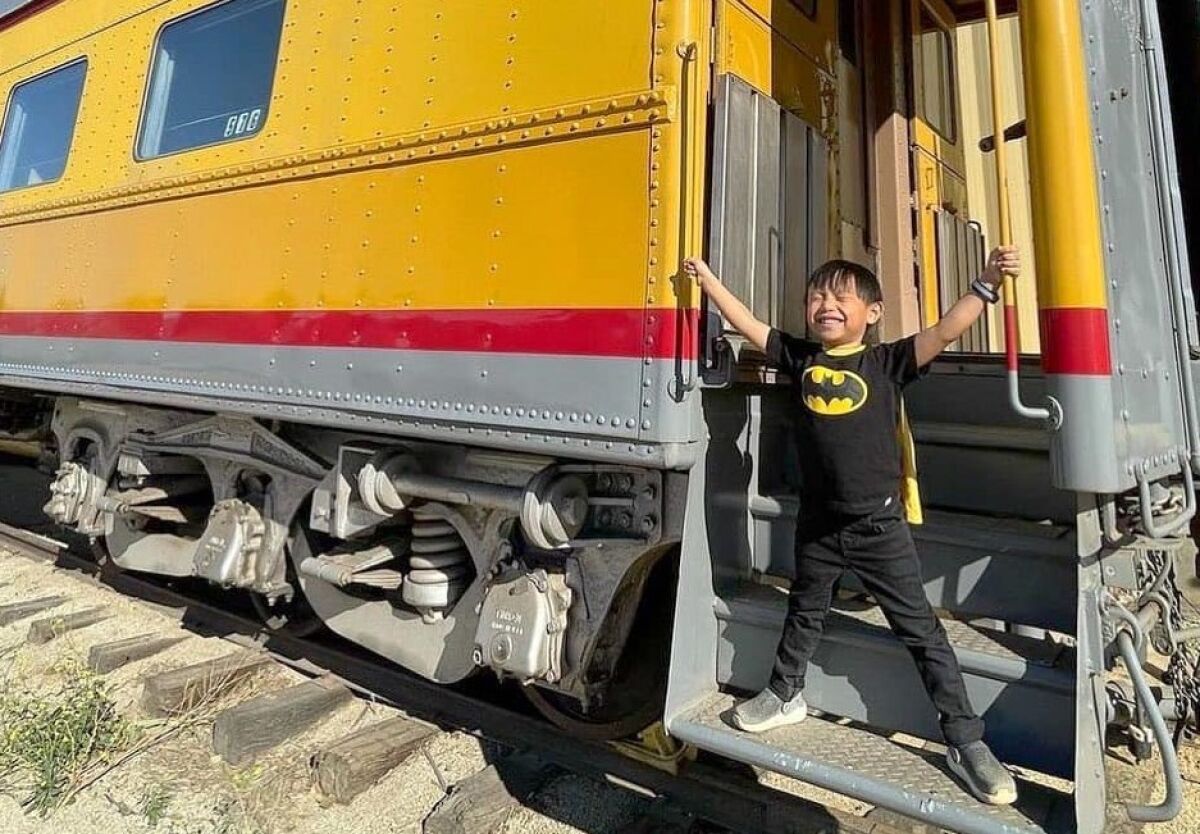 A boy plays on one of the trains at the Pacific Southwest Railway Museum in Campo.