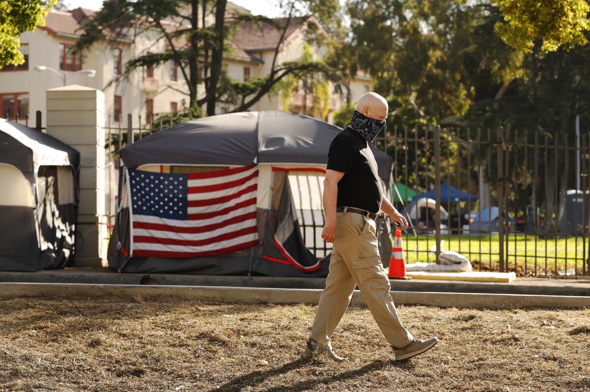 Don Wood observes a new growing homeless encampment outside the Los Angeles National Veterans Park.