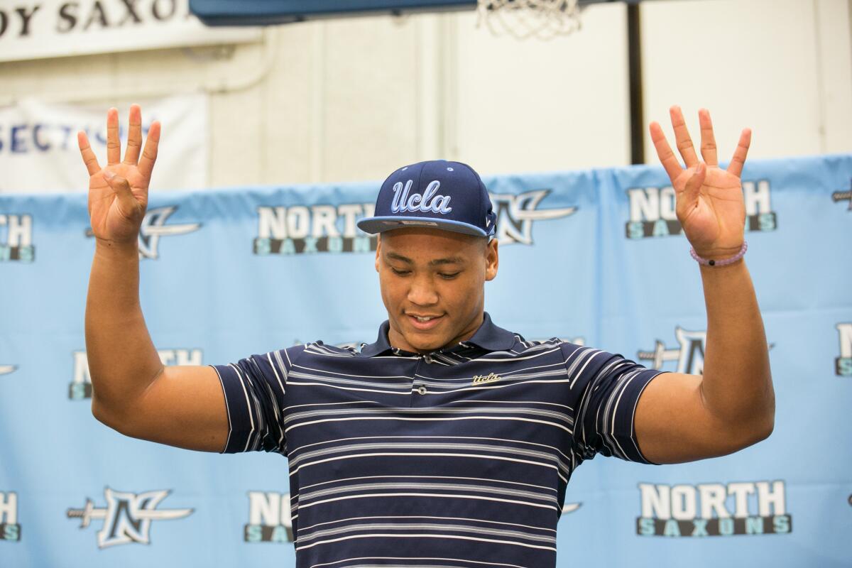 North Torrance High linebacker Mique Juarez announces his committment to UCLA during National signing day on Feb. 3.