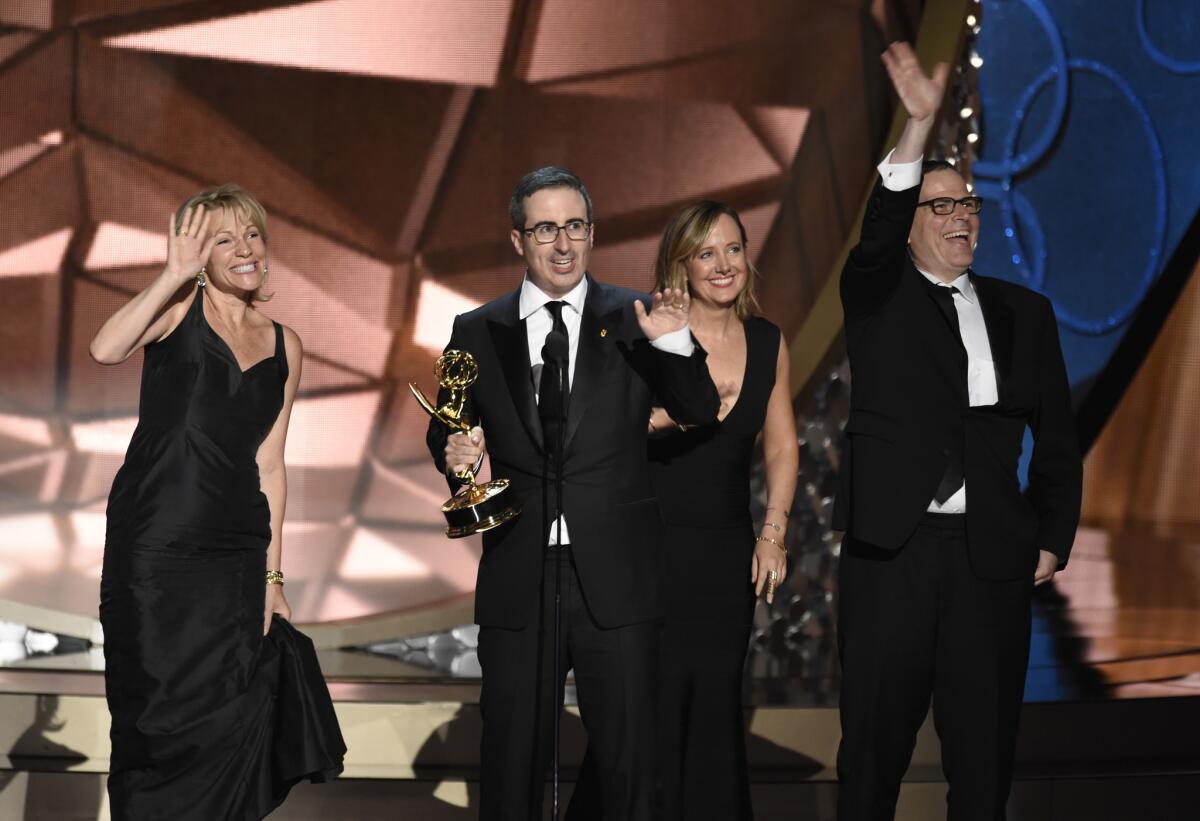 John Oliver and the crew of “Last Week Tonight With John Oliver” accept the award for variety talk series.