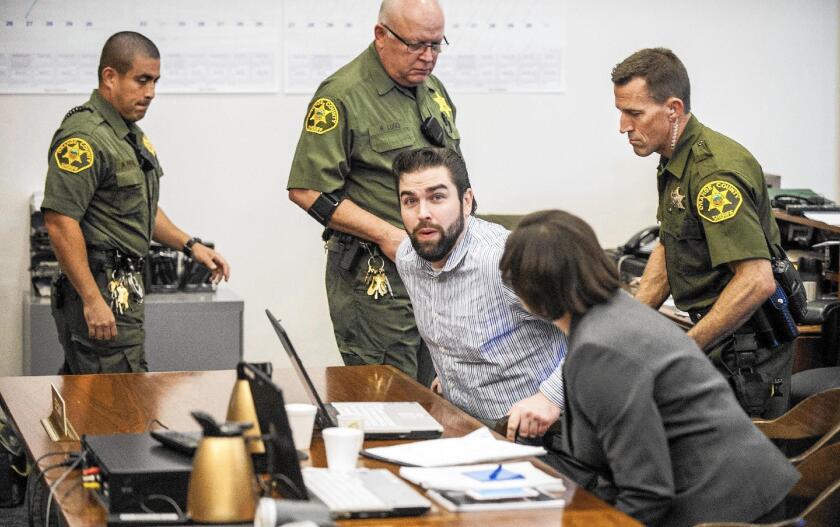 Orange County Sheriff deputies seat Daniel Wozniak in Superior Court in Santa Ana Friday morning for his sentencing. Wozniak was convicted in the killing of two people to bankroll his wedding and honeymoon.