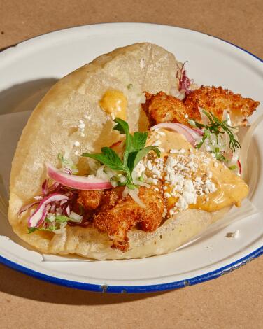 LOS ANGELES , CA - AUGUST 25: The shrimp puffy taco from Bar Ama on Friday, Oct. 14, 2022 in Los Angeles , CA. (Shelby Moore / For The Times)