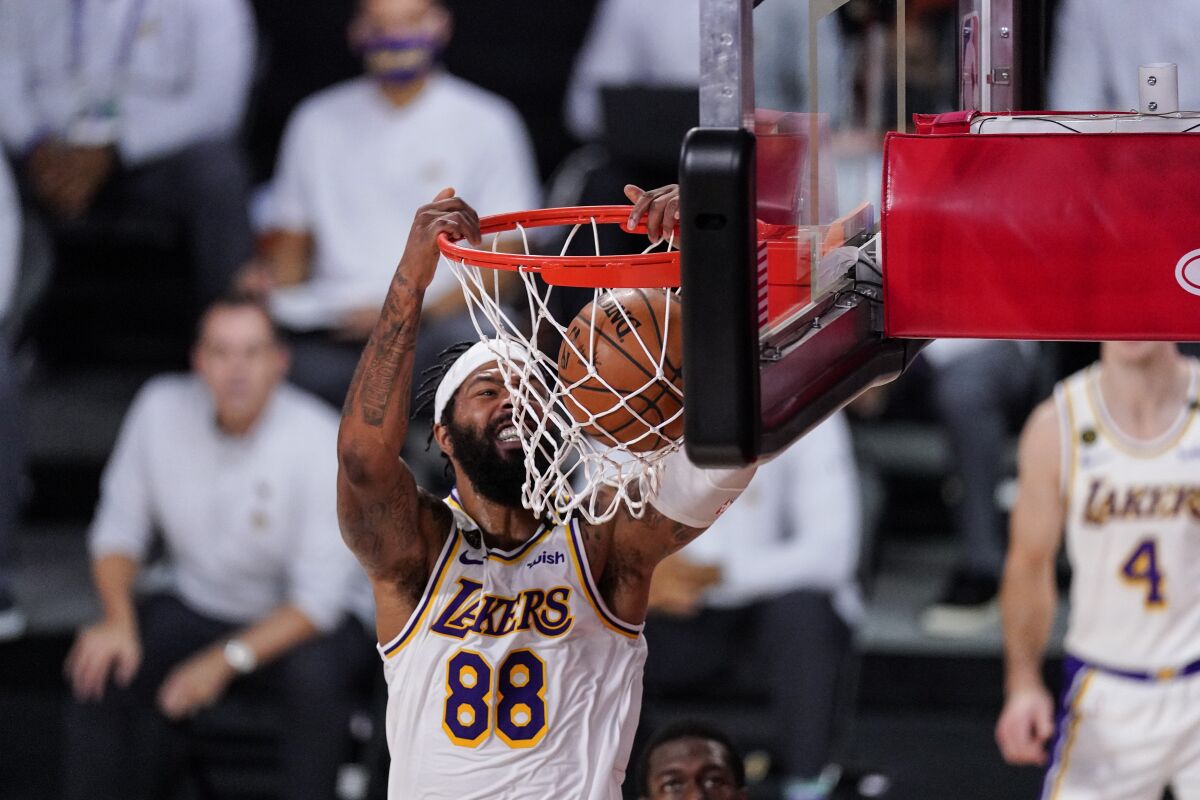 Lakers forward Markieff Morris dunks.