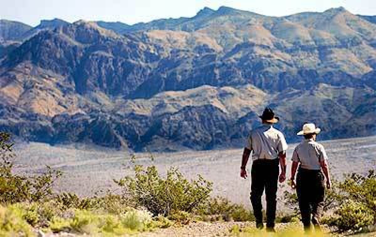 Dick Birger and Amy Sprunger walk in Nevada's Desert National Wildlife Refuge. 