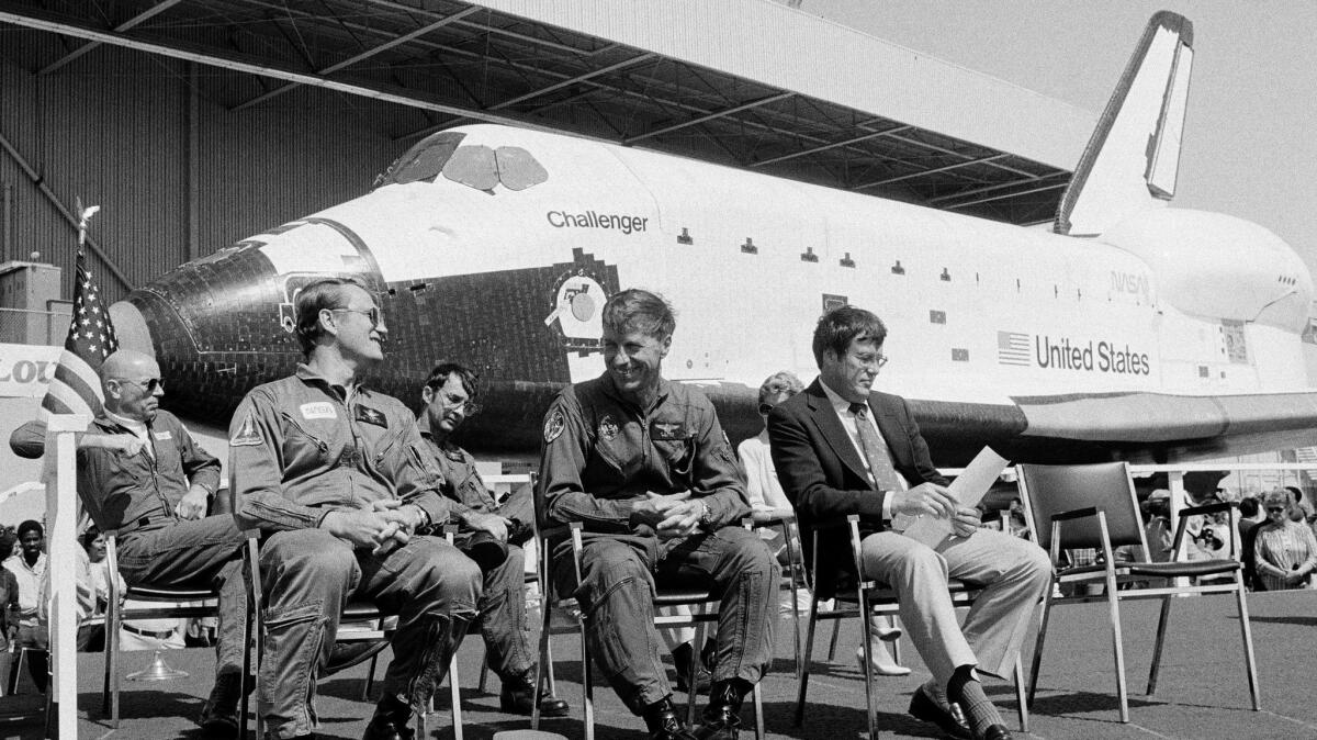 Commander Paul J. Weitz, front row, center, pictured on June 30, 1982, sitting in front of the space shuttle Challenger.