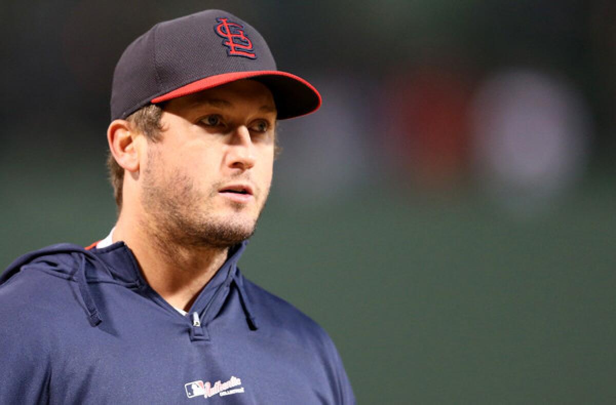 David Freese waits for Game 1 of the World Series at Fenway Park in Boston.