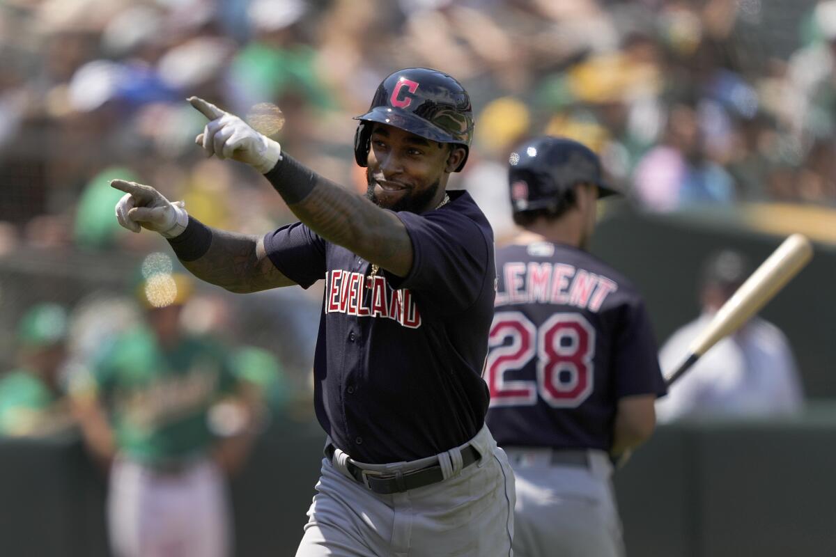 Cleveland Indians' Daniel Johnson points to the crowd after hitting a solo home run against the Oakland Athletics during the seventh inning of a baseball game Sunday, July 18, 2021, in Oakland, Calif. (AP Photo/Tony Avelar)