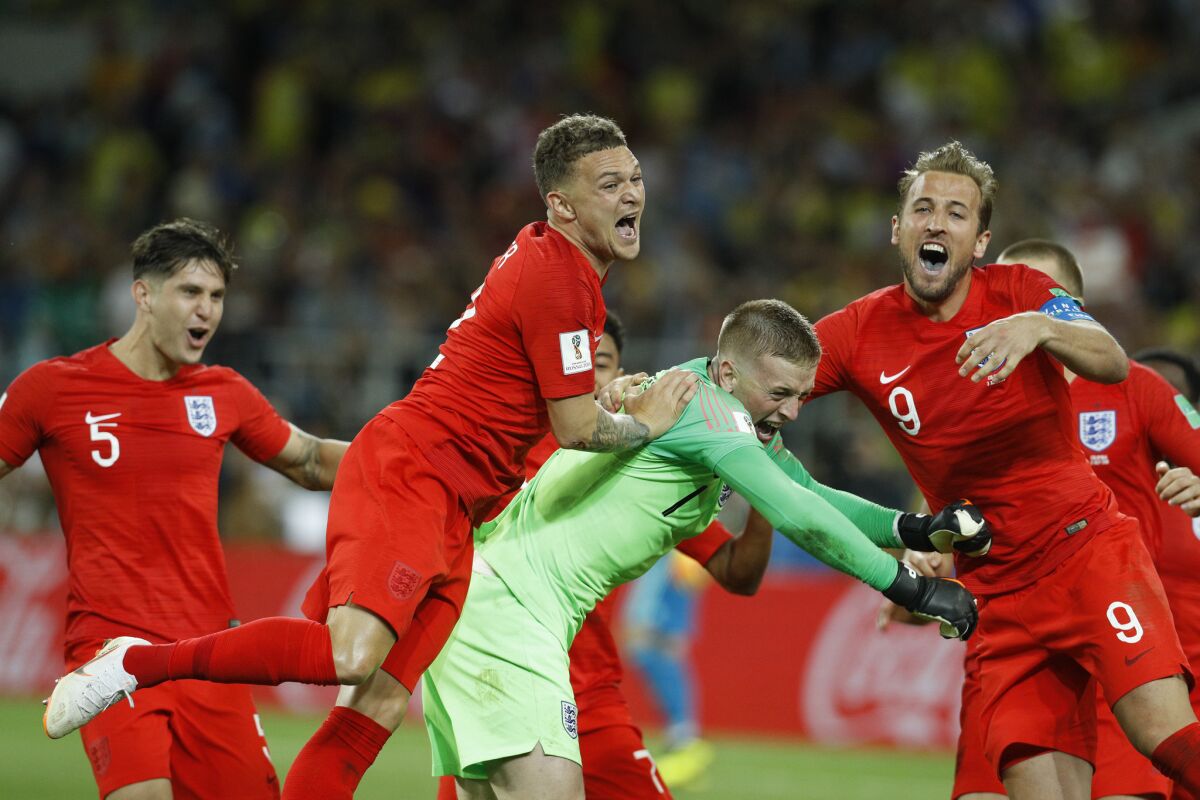 England players celebrate after defeating Colombia on penalty kicks.