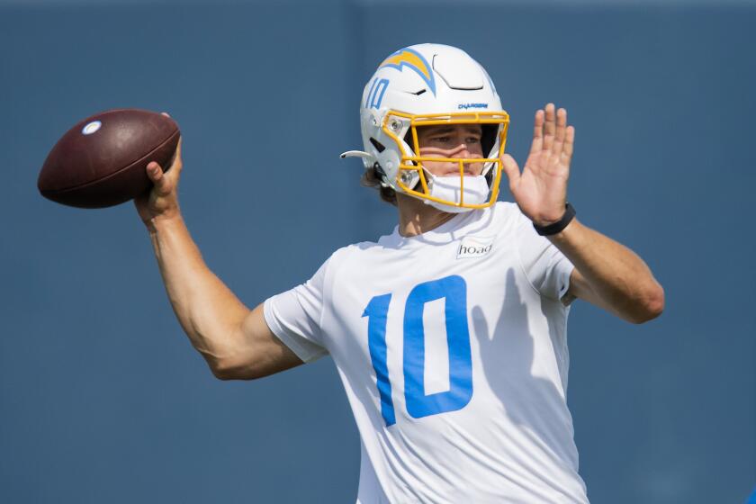 Los Angeles Chargers quarterback Justin Herbert (10) throws a pass during NFL football practice Tuesday, June 15, 2021, in Costa Mesa, Calif. (AP Photo/Kyusung Gong)